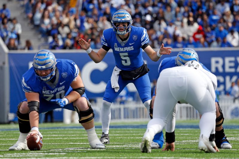 Nov 5, 2022; Memphis, Tennessee, USA; Memphis Tigers quarterback Seth Henigan (5) prepares to take the snap during the first half against the UCF Knights at Liberty Bowl Memorial Stadium. Mandatory Credit: Petre Thomas-USA TODAY Sports