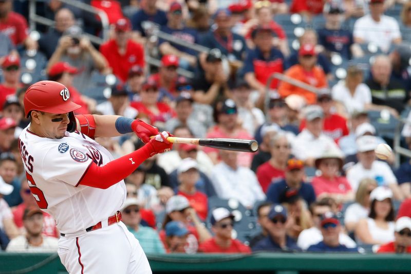 Apr 16, 2023; Washington, District of Columbia, USA; Washington Nationals first baseman Joey Meneses (45) hits a go-ahead RBI single against the Cleveland Guardians during the eighth inning at Nationals Park. Mandatory Credit: Geoff Burke-USA TODAY Sports