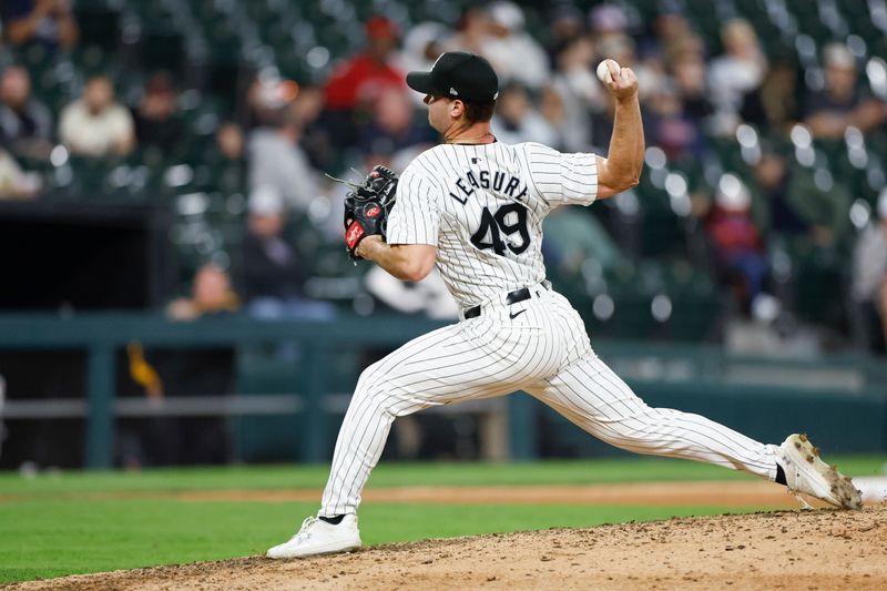 Apr 30, 2024; Chicago, Illinois, USA; Chicago White Sox relief pitcher Jordan Leasure (49) delivers a pitch against the Minnesota Twins during the eight inning at Guaranteed Rate Field. Mandatory Credit: Kamil Krzaczynski-USA TODAY Sports