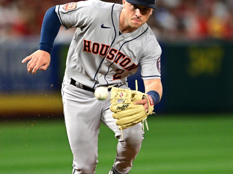 Apr 7, 2022; Anaheim, California, USA; Houston Astros third baseman Alex Bregman (2) field a ball and throws out Los Angeles Angels catcher Max Stassi (not pictured) at first in the fifth inning at Angel Stadium. Mandatory Credit: Jayne Kamin-Oncea-USA TODAY Sports