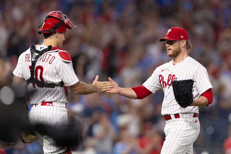 Aug 5, 2023; Philadelphia, Pennsylvania, USA; Philadelphia Phillies relief pitcher Craig Kimbrel (31) and catcher J.T. Realmuto (10) shake hands after a victory against the Kansas City Royals at Citizens Bank Park. Mandatory Credit: Bill Streicher-USA TODAY Sports