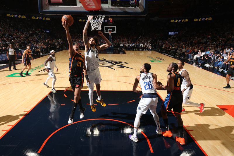 OKLAHOMA CITY, OK - NOVEMBER 17: Aaron Wiggins #21 of the Oklahoma City Thunder drives to the basket during the game against the Dallas Mavericks on November 17, 2024 at Paycom Center in Oklahoma City, Oklahoma. NOTE TO USER: User expressly acknowledges and agrees that, by downloading and or using this photograph, User is consenting to the terms and conditions of the Getty Images License Agreement. Mandatory Copyright Notice: Copyright 2024 NBAE (Photo by Zach Beeker/NBAE via Getty Images)