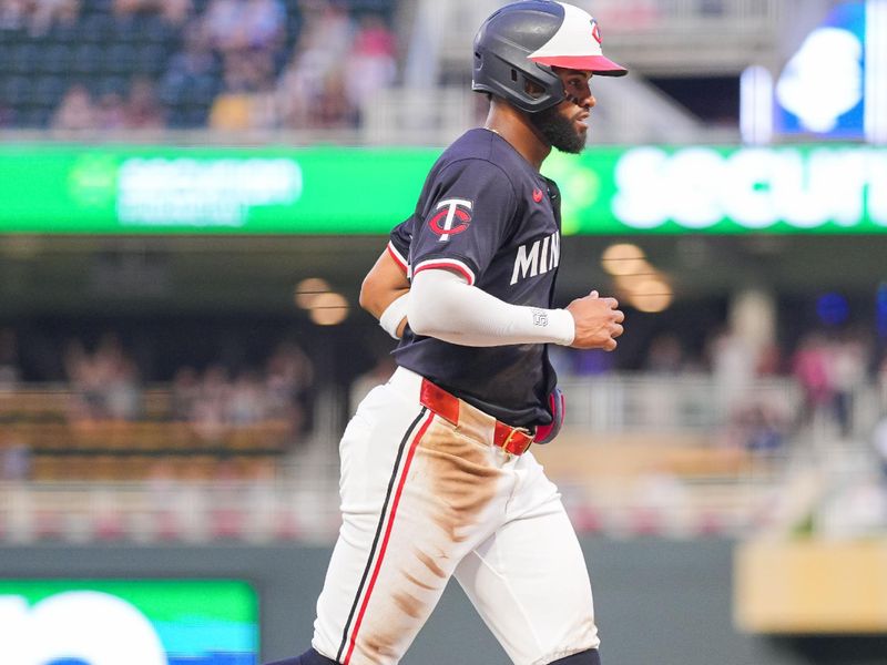 Jun 18, 2024; Minneapolis, Minnesota, USA; Minnesota Twins second base Willi Castro (50) scores against the Tampa Bay Rays in the fourth inning at Target Field. Mandatory Credit: Brad Rempel-USA TODAY Sports