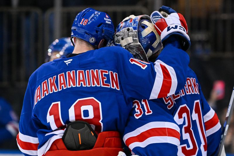 Jan 21, 2025; New York, New York, USA;  New York Rangers defenseman Urho Vaakanainen (18) celebrates the 5-0 victory with New York Rangers goaltender Igor Shesterkin (31) against the Ottawa Senators after the game at Madison Square Garden. Mandatory Credit: Dennis Schneidler-Imagn Images