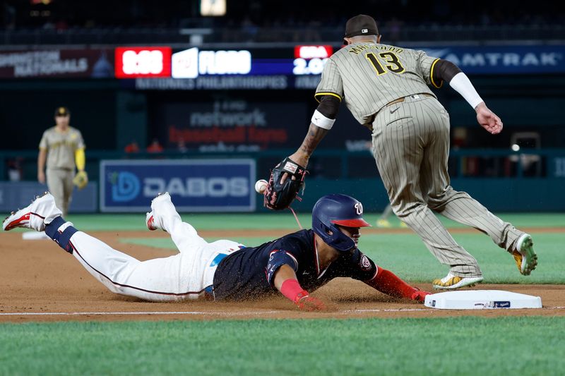 Jul 24, 2024; Washington, District of Columbia, USA; Washington Nationals second baseman Luis García Jr. (2) slides into third base for a triple ahead of a throw to San Diego Padres third baseman Manny Machado (13) during the seventh inning at Nationals Park. Mandatory Credit: Geoff Burke-USA TODAY Sports