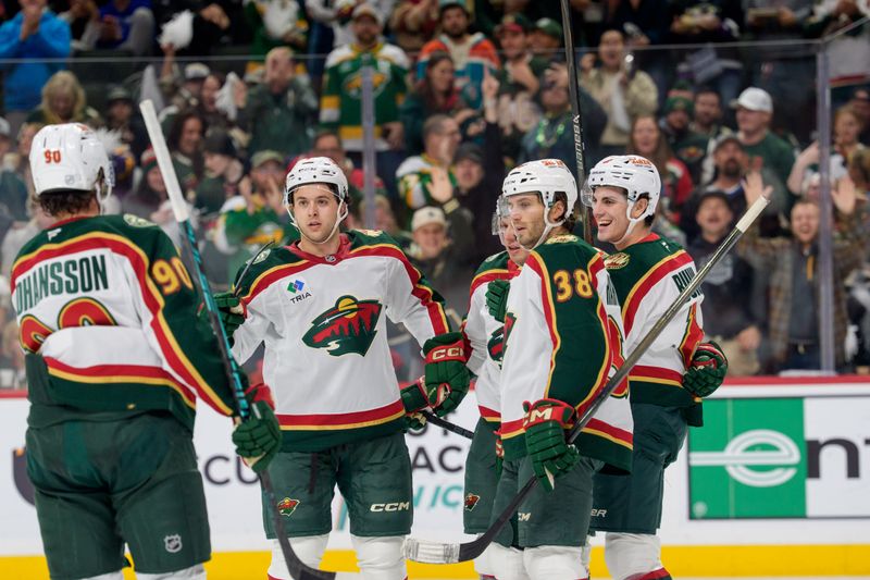Nov 4, 2025; Saint Paul, Minnesota, USA; Minnesota Wild defenseman Zeev Buium (8) is congratulated by teammates after scoring on the Nashville Predators in the second period at Grand Casino Arena. Mandatory Credit: Matt Blewett-Imagn Images
