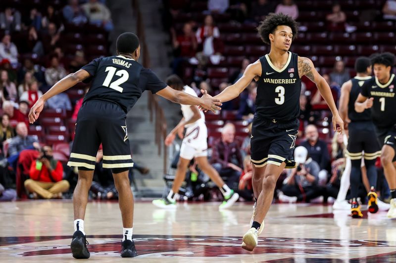 Feb 14, 2023; Columbia, South Carolina, USA; Vanderbilt Commodores guard Paul Lewis (3) and guard Trey Thomas (12) celebrate a three pointer basket by Lewis in the first half at Colonial Life Arena. Mandatory Credit: Jeff Blake-USA TODAY Sports