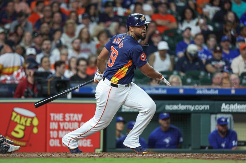 Apr 2, 2024; Houston, Texas, USA; Houston Astros first baseman Jose Abreu (79) hits a single during the seventh inning against the Toronto Blue Jays at Minute Maid Park. Mandatory Credit: Troy Taormina-USA TODAY Sports