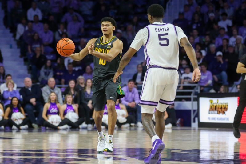 Jan 16, 2024; Manhattan, Kansas, USA; Baylor Bears guard RayJ Dennis (10) passes the ball away from Kansas State Wildcats guard Cam Carter (5) during overtime at Bramlage Coliseum. Mandatory Credit: Scott Sewell-USA TODAY Sports