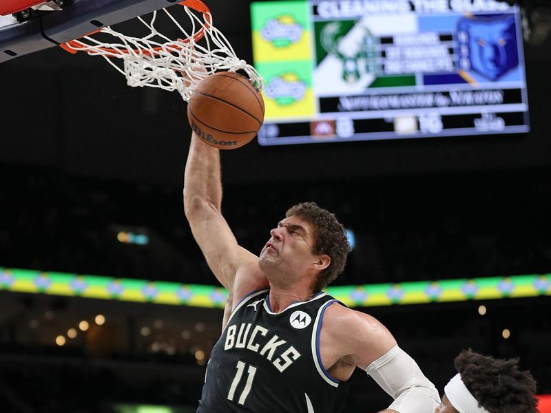 MEMPHIS, TENNESSEE - FEBRUARY 15: Brook Lopez #11 of the Milwaukee Bucks goes to the basket during the first half against the Memphis Grizzlies at FedExForum on February 15, 2024 in Memphis, Tennessee. NOTE TO USER: User expressly acknowledges and agrees that, by downloading and or using this photograph, User is consenting to the terms and conditions of the Getty Images License Agreement. (Photo by Justin Ford/Getty Images)