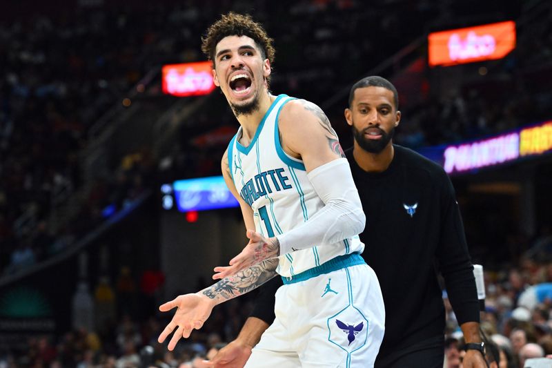 CLEVELAND, OHIO - NOVEMBER 17: LaMelo Ball #1 of the Charlotte Hornets reacts during the first quarter against the Cleveland Cavaliers at Rocket Mortgage Fieldhouse on November 17, 2024 in Cleveland, Ohio. NOTE TO USER: User expressly acknowledges and agrees that, by downloading and or using this photograph, User is consenting to the terms and conditions of the Getty Images License Agreement. (Photo by Jason Miller/Getty Images)