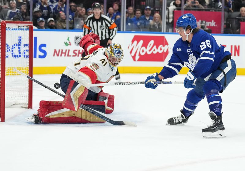 Nov 28, 2023; Toronto, Ontario, CAN; Toronto Maple Leafs right wing William Nylander (88) attempts a shot on Florida Panthers goaltender Anthony Stolarz (41) during the shootout  at Scotiabank Arena. Mandatory Credit: Nick Turchiaro-USA TODAY Sports