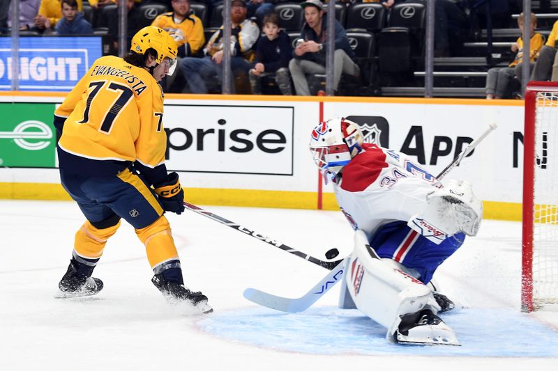 Mar 5, 2024; Nashville, Tennessee, USA; Nashville Predators right wing Luke Evangelista (77) has a shot blocked by Montreal Canadiens goaltender Jake Allen (34) during the first period at Bridgestone Arena. Mandatory Credit: Christopher Hanewinckel-USA TODAY Sports