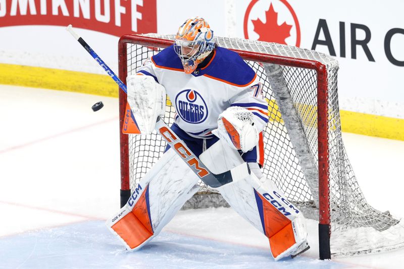 Mar 26, 2024; Winnipeg, Manitoba, CAN; Edmonton Oilers goaltender Stuart Skinner (74) warms up before a game against the Winnipeg Jets at Canada Life Centre. Mandatory Credit: James Carey Lauder-USA TODAY Sports