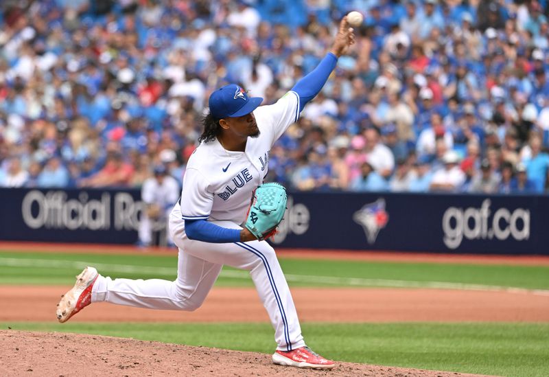 Aug 27, 2023; Toronto, Ontario, CAN;  Toronto Blue Jays relief pitcher Genesis Cabrera (92) delivers a pitch against the Cleveland Guardians in the seventh inning at Rogers Centre. Mandatory Credit: Dan Hamilton-USA TODAY Sports