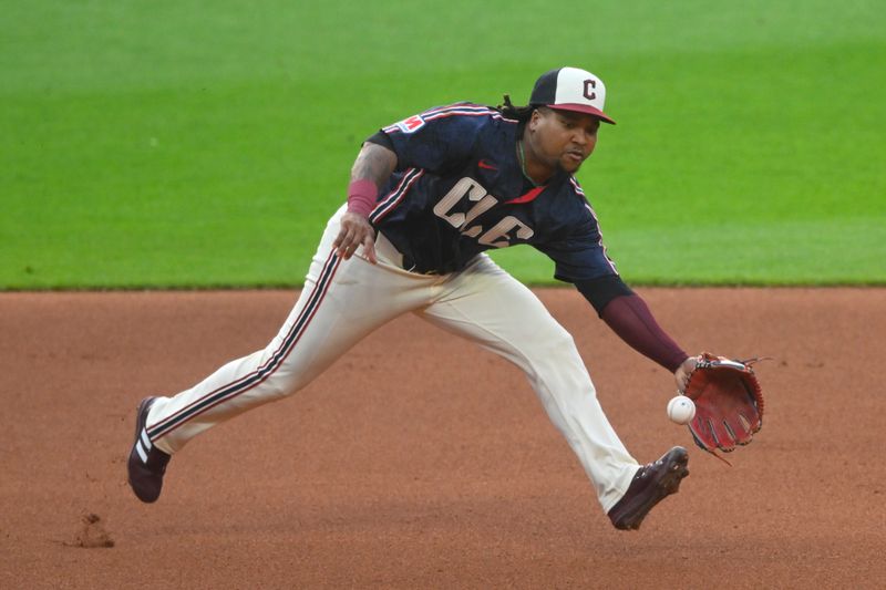 Jun 18, 2024; Cleveland, Ohio, USA; Cleveland Guardians third baseman Jose Ramirez (11) fields a ground ball in the fourth inning against the Seattle Mariners at Progressive Field. Mandatory Credit: David Richard-USA TODAY Sports