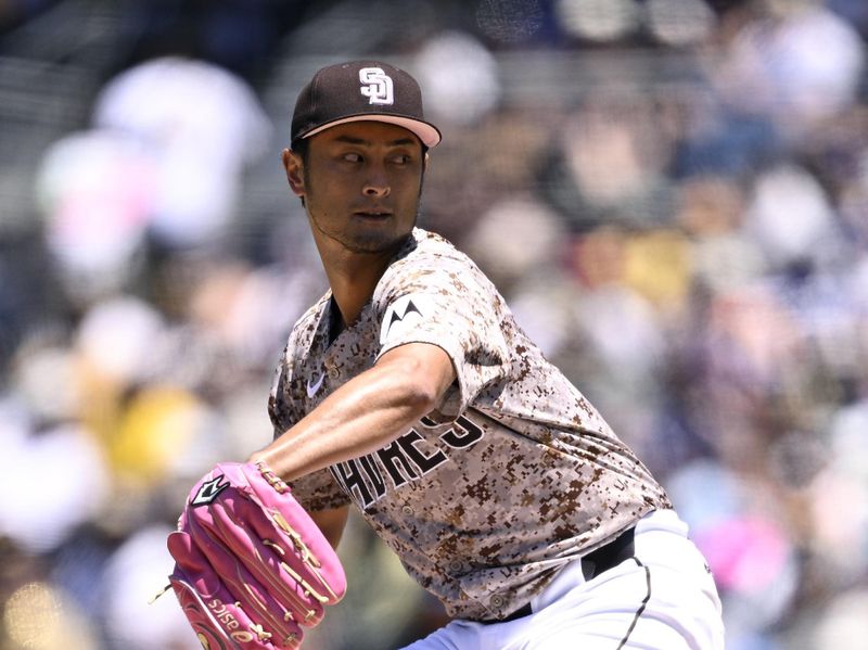 May 12, 2024; San Diego, California, USA; San Diego Padres starting pitcher Yu Darvish (11) throws a pitch against the Los Angeles Dodgers during the first inning at Petco Park. Mandatory Credit: Orlando Ramirez-USA TODAY Sports