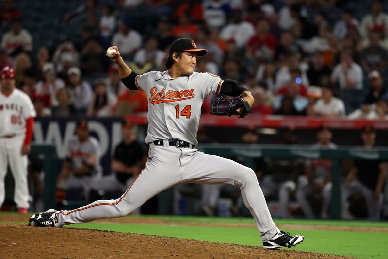 Sep 6, 2023; Anaheim, California, USA; Baltimore Orioles relief pitcher Shintaro Fujinami (14) pitches during the eighth inning against the Los Angeles Angels at Angel Stadium. Mandatory Credit: Kiyoshi Mio-USA TODAY Sports