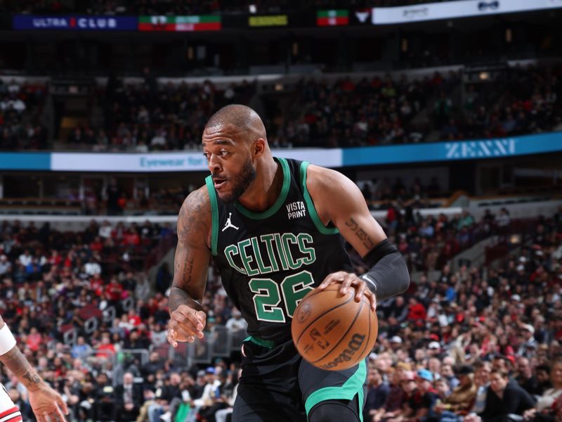 CHICAGO, IL - MARCH 23: Xavier Tillman #26 of the Boston Celtics handles the ball during the game against the Chicago Bulls on March 23, 2024 at United Center in Chicago, Illinois. NOTE TO USER: User expressly acknowledges and agrees that, by downloading and or using this photograph, User is consenting to the terms and conditions of the Getty Images License Agreement. Mandatory Copyright Notice: Copyright 2024 NBAE (Photo by Jeff Haynes/NBAE via Getty Images)