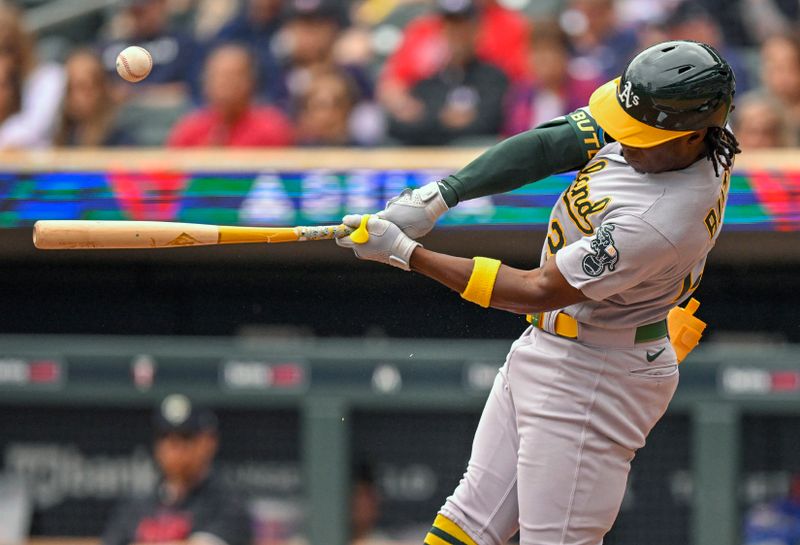 Sep 28, 2023; Minneapolis, Minnesota, USA; Oakland Athletics outfielder Lawrence Butler (22) breaks his bat as he flies out against the Minnesota Twins during the second inning at Target Field. Mandatory Credit: Nick Wosika-USA TODAY Sports