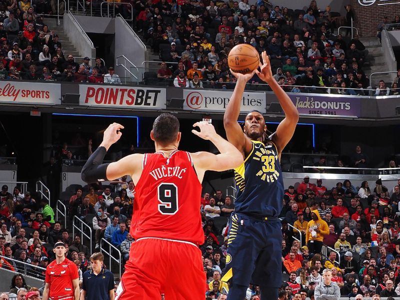 INDIANAPOLIS, IN - JANUARY 24: Myles Turner #33 of the Indiana Pacers shoots a three point basket during the game against the Chicago Bulls on January 24, 2023 at Gainbridge Fieldhouse in Indianapolis, Indiana. NOTE TO USER: User expressly acknowledges and agrees that, by downloading and or using this Photograph, user is consenting to the terms and conditions of the Getty Images License Agreement. Mandatory Copyright Notice: Copyright 2022 NBAE (Photo by Ron Hoskins/NBAE via Getty Images)