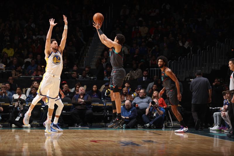 WASHINGTON, DC -? FEBRUARY 27: Jordan Poole #13 of the Washington Wizards shoots a three point basket over Klay Thompson #11 of the Golden State Warriors during the game on February 27, 2024 at Capital One Arena in Washington, DC. NOTE TO USER: User expressly acknowledges and agrees that, by downloading and or using this Photograph, user is consenting to the terms and conditions of the Getty Images License Agreement. Mandatory Copyright Notice: Copyright 2024 NBAE (Photo by Stephen Gosling/NBAE via Getty Images)