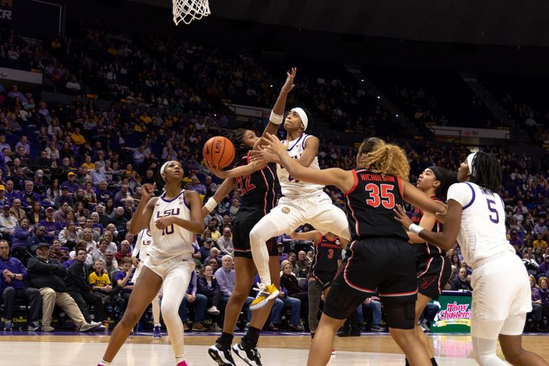 Feb 2, 2023; Baton Rouge, Louisiana, USA;  LSU Lady Tigers guard Alexis Morris (45) drives to the basket against Georgia Lady Bulldogs forward Malury Bates (22) during the first half at Pete Maravich Assembly Center. Mandatory Credit: Stephen Lew-USA TODAY Sports