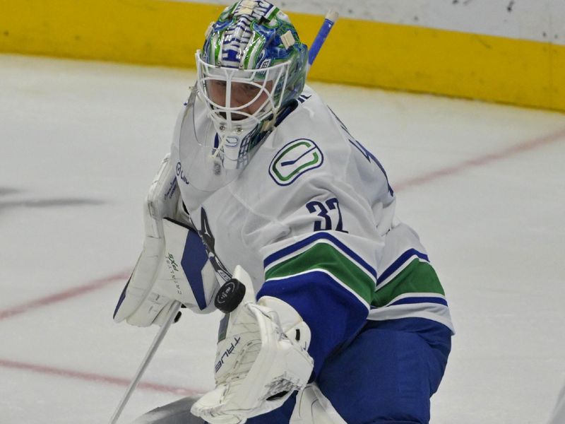 Nov 5, 2024; Anaheim, California, USA; Vancouver Canucks goaltender Kevin Lankinen (32) makes a save in the third period against the Anaheim Ducks at Honda Center. Mandatory Credit: Jayne Kamin-Oncea-Imagn Images