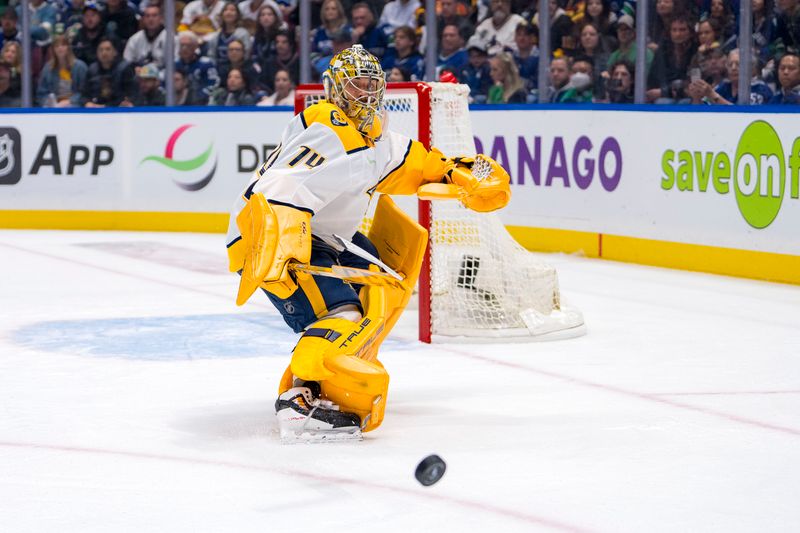 Apr 21, 2024; Vancouver, British Columbia, CAN; Nashville Predators goalie Juuse Saros (74) handles the puck against the Vancouver Canucks in the first period in game one of the first round of the 2024 Stanley Cup Playoffs at Rogers Arena. Mandatory Credit: Bob Frid-USA TODAY Sports