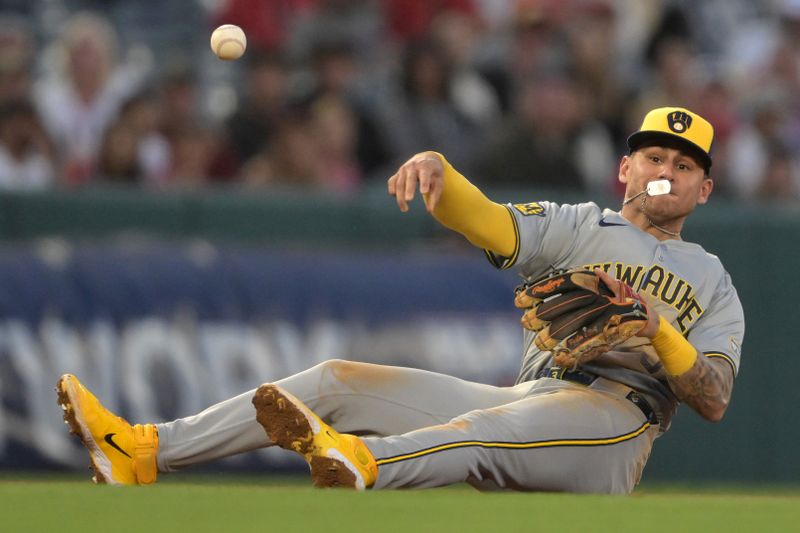 Jun 19, 2024; Anaheim, California, USA;  Milwaukee Brewers third baseman Joey Ortiz (3) makes a throw from the ground but can’t get Los Angeles Angels third baseman Luis Rengifo (2) out at first in the fifth inning at Angel Stadium. Mandatory Credit: Jayne Kamin-Oncea-USA TODAY Sports