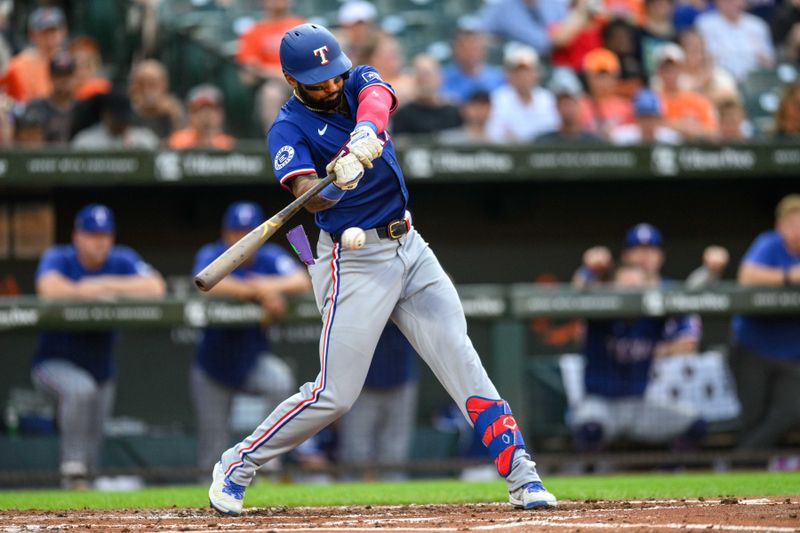 Jun 30, 2024; Baltimore, Maryland, USA; Texas Rangers outfielder Derek Hill (40) hits a home run during the second inning against the Baltimore Orioles at Oriole Park at Camden Yards. Mandatory Credit: Reggie Hildred-USA TODAY Sports