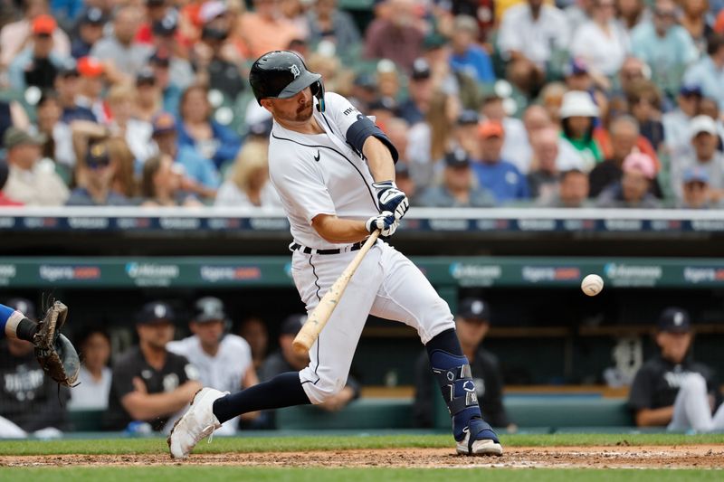 Aug 23, 2023; Detroit, Michigan, USA;  Detroit Tigers catcher Jake Rogers (34) hits a single in the sixth inning against the Chicago Cubs at Comerica Park. Mandatory Credit: Rick Osentoski-USA TODAY Sports