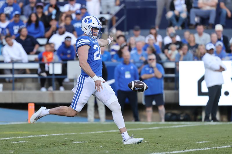 Oct 21, 2023; Provo, Utah, USA; Brigham Young Cougars punter Ryan Rehkow (24) punts the ball to the Texas Tech Red Raiders in the first half at LaVell Edwards Stadium. Mandatory Credit: Rob Gray-USA TODAY Sports