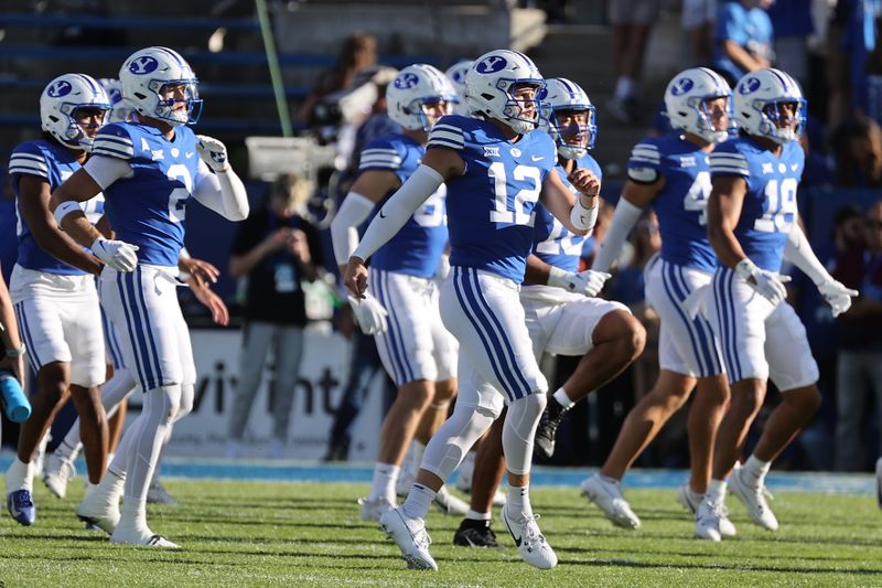 Oct 21, 2023; Provo, Utah, USA; The Brigham Young Cougars warm up before a game against the Texas Tech Red Raiders at LaVell Edwards Stadium. Mandatory Credit: Rob Gray-USA TODAY Sports