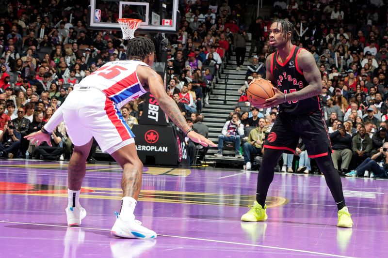 TORONTO, CANADA - NOVEMBER 15: Davion Mitchell #45 of the Toronto Raptors handles the ball during the game against the Detroit Pistons during the Emirates NBA CUP game  on November 15, 2024 at the Scotiabank Arena in Toronto, Ontario, Canada.  NOTE TO USER: User expressly acknowledges and agrees that, by downloading and or using this Photograph, user is consenting to the terms and conditions of the Getty Images License Agreement.  Mandatory Copyright Notice: Copyright 2024 NBAE (Photo by Mark Blinch/NBAE via Getty Images)