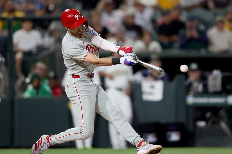 May 23, 2025; West Sacramento, California, USA; Philadelphia Phillies shortstop Trea Turner (7) hits a single against the Athletics during the eighth inning at Sutter Health Park. Mandatory Credit: Dennis Lee-Imagn Images