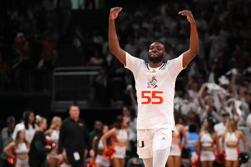 Feb 6, 2023; Coral Gables, Florida, USA; Miami Hurricanes guard Wooga Poplar (55) celebrates defeating the Duke Blue Devils at Watsco Center. Mandatory Credit: Jasen Vinlove-USA TODAY Sports