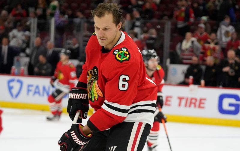 Jan 22, 2023; Chicago, Illinois, USA; Chicago Blackhawks defenseman Jake McCabe (6) warms up before the game against the Los Angeles Kings at United Center. Mandatory Credit: David Banks-USA TODAY Sports