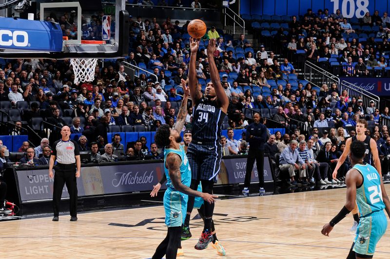 ORLANDO, FL - MARCH 19: Wendell Carter Jr. #34 of the Orlando Magic shoots the ball during the game against the Charlotte Hornets on March 19, 2024 at the Kia Center in Orlando, Florida. NOTE TO USER: User expressly acknowledges and agrees that, by downloading and or using this photograph, User is consenting to the terms and conditions of the Getty Images License Agreement. Mandatory Copyright Notice: Copyright 2024 NBAE (Photo by Fernando Medina/NBAE via Getty Images)