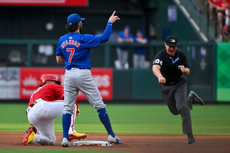 Jul 12, 2024; St. Louis, Missouri, USA;  Chicago Cubs shortstop Dansby Swanson (7) reacts as umpire David Arrieta (100) calls out St. Louis Cardinals catcher Willson Contreras (40) during the first inning at Busch Stadium. Mandatory Credit: Jeff Curry-USA TODAY Sports