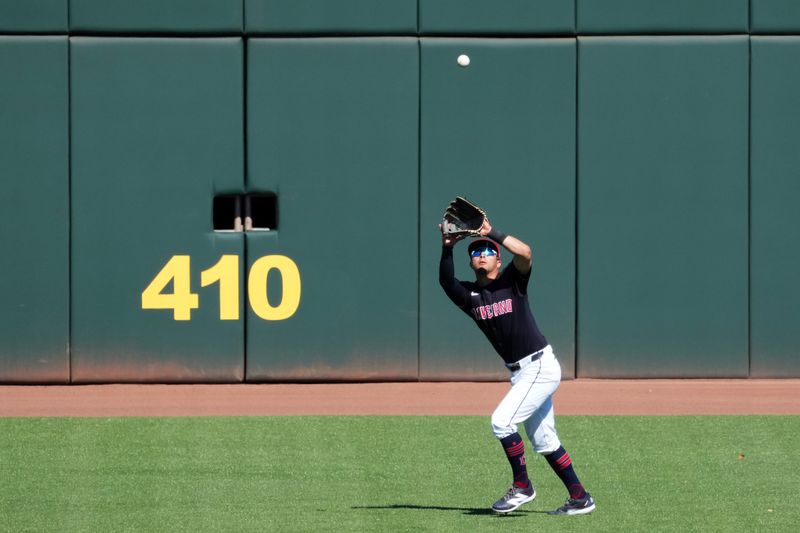 Mar 2, 2024; Goodyear, Arizona, USA; Cleveland Guardians center fielder Tyler Freeman (2) catches a fly ball against the Kansas City Royals during the second inning at Goodyear Ballpark. Mandatory Credit: Joe Camporeale-USA TODAY Sports