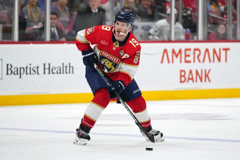 Jan 11, 2024; Sunrise, Florida, USA; Florida Panthers left wing Matthew Tkachuk (19) controls the puck against the Los Angeles Kings during the second period at Amerant Bank Arena. Mandatory Credit: Jasen Vinlove-USA TODAY Sports