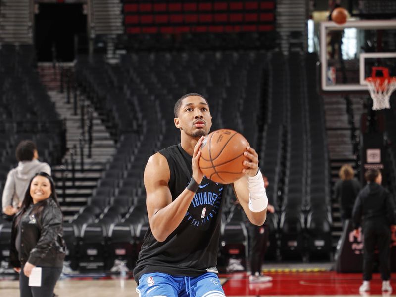 PORTLAND, OR - JANUARY 26: Aaron Wiggins #21 of the Oklahoma City Thunder warms up before the game against the Portland Trail Blazers on January 26, 2025 at the Moda Center Arena in Portland, Oregon. NOTE TO USER: User expressly acknowledges and agrees that, by downloading and or using this photograph, user is consenting to the terms and conditions of the Getty Images License Agreement. Mandatory Copyright Notice: Copyright 2025 NBAE (Photo by Cameron Browne/NBAE via Getty Images)