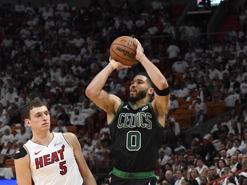 MIAMI, FL - APRIL 27: Jayson Tatum #0 of the Boston Celtics shoots a three point basket against the Miami Heat during Round 1 Game 3 of the 2024 NBA Playoffs on April 27, 2024 at Kaseya Center in Miami, Florida. NOTE TO USER: User expressly acknowledges and agrees that, by downloading and or using this Photograph, user is consenting to the terms and conditions of the Getty Images License Agreement. Mandatory Copyright Notice: Copyright 2024 NBAE (Photo by Brian Babineau/NBAE via Getty Images)