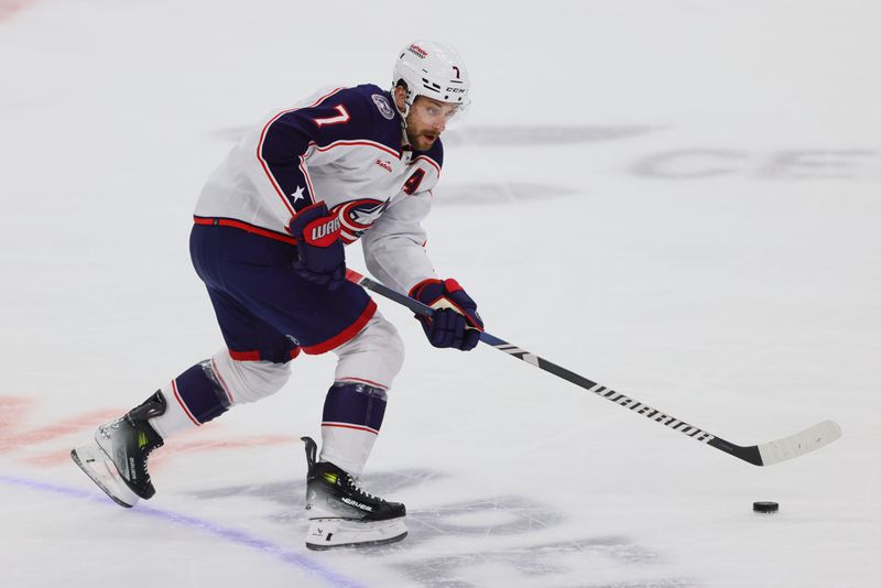 Apr 11, 2024; Sunrise, Florida, USA; Columbus Blue Jackets center Sean Kuraly (7) moves the puck against the Florida Panthers during the first period at Amerant Bank Arena. Mandatory Credit: Sam Navarro-USA TODAY Sports