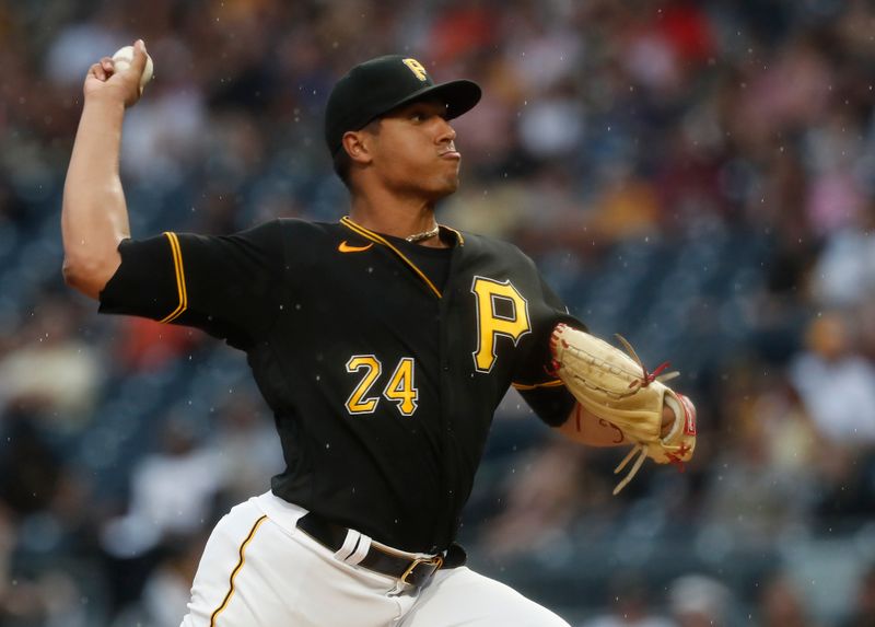 Jul 15, 2023; Pittsburgh, Pennsylvania, USA;  Pittsburgh Pirates starting pitcher Johan Oviedo (24) delivers against the San Francisco Giants during the first inning at PNC Park. Mandatory Credit: Charles LeClaire-USA TODAY Sports