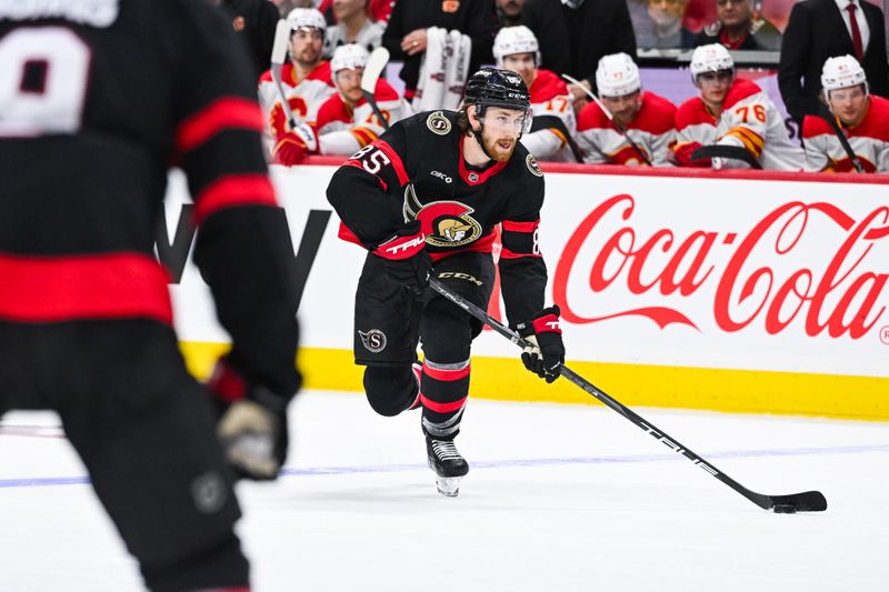 Nov 25, 2024; Ottawa, Ontario, CAN; Ottawa Senators defenseman Jake Sanderson (85) plays the puck against the Calgary Flames  during the first period at Canadian Tire Centre. Mandatory Credit: David Kirouac-Imagn Images