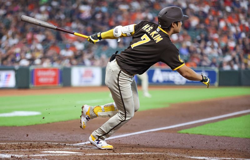 Sep 10, 2023; Houston, Texas, USA; San Diego Padres second baseman Ha-Seong Kim (7) hits a single during the third inning against the Houston Astros at Minute Maid Park. Mandatory Credit: Troy Taormina-USA TODAY Sports