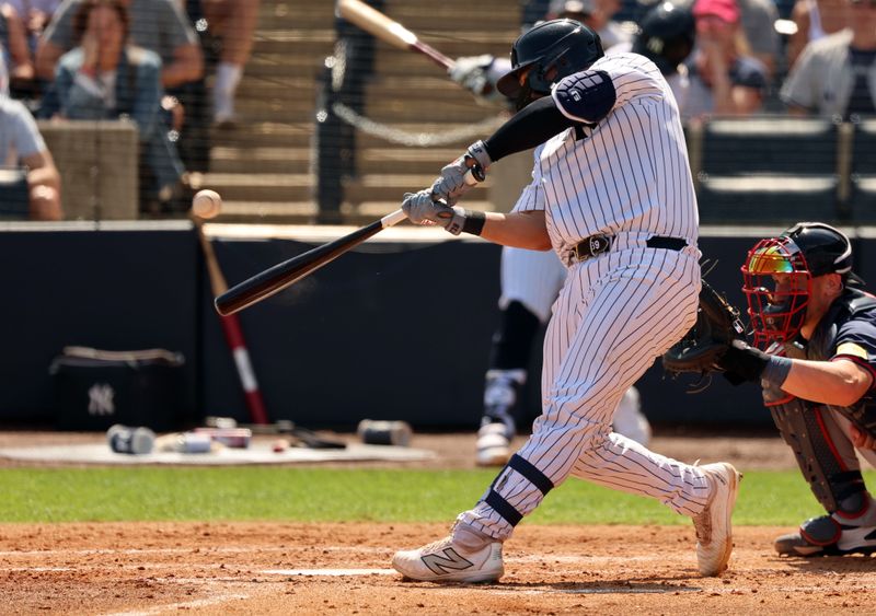 Mar 10, 2024; Tampa, Florida, USA; New York Yankees catcher Jose Trevino (39) hits a sacrifice RBI during the second inning against the Atlanta Braves at George M. Steinbrenner Field. Mandatory Credit: Kim Klement Neitzel-USA TODAY Sports