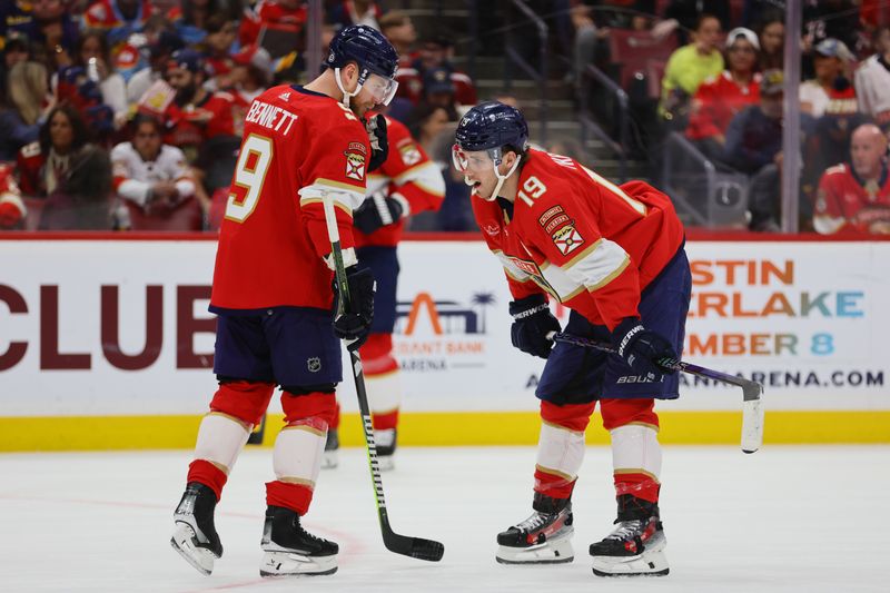 Apr 13, 2024; Sunrise, Florida, USA; Florida Panthers center Sam Bennett (9) and left wing Matthew Tkachuk (19) talk against the Buffalo Sabres during the second period at Amerant Bank Arena. Mandatory Credit: Sam Navarro-USA TODAY Sports